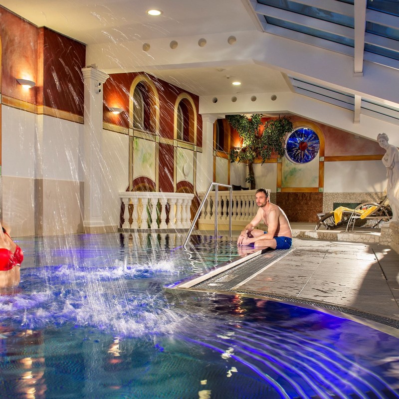 Guests swim in the indoor pool at the Ski Hotel Zehnerkar