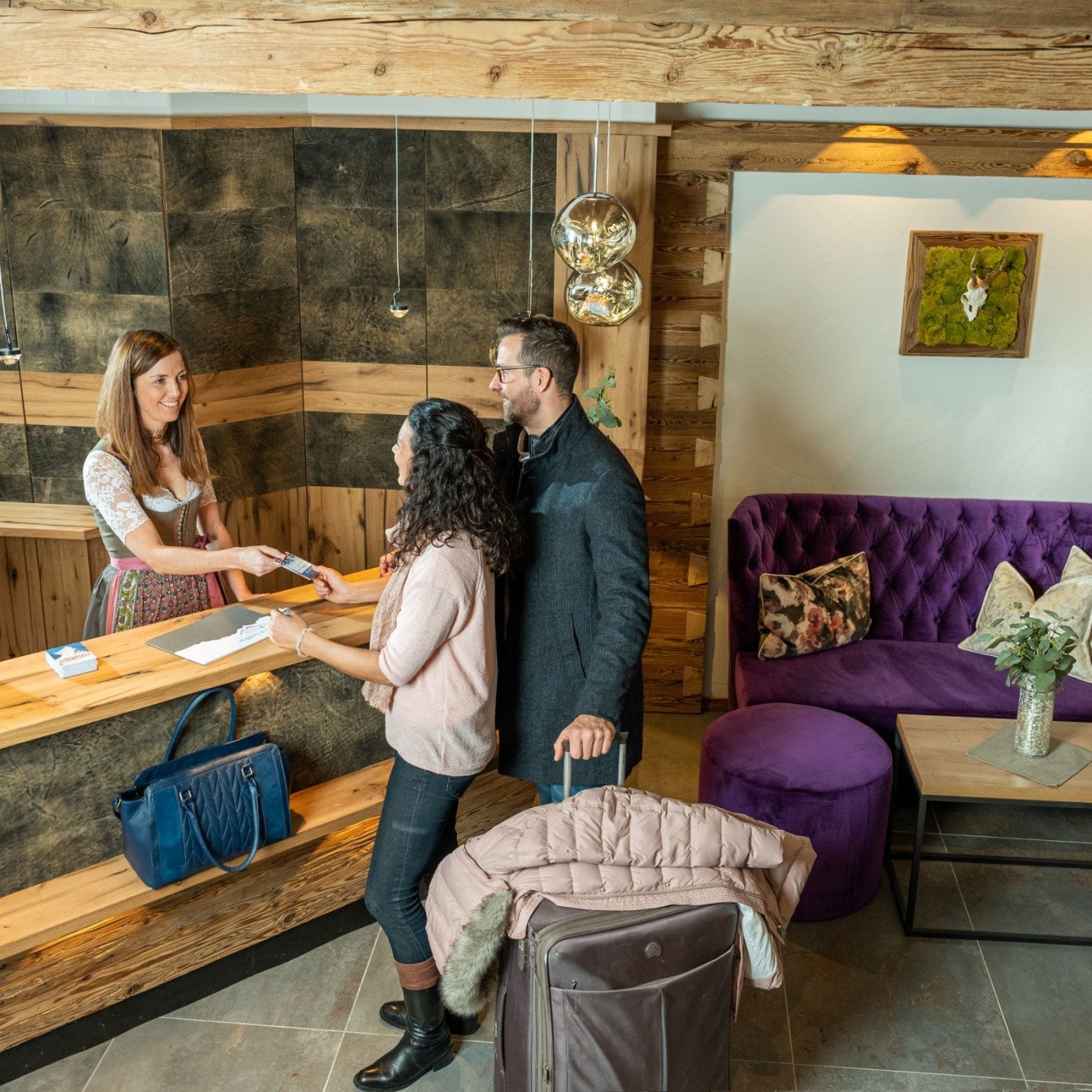 Hostess Iris Hollfelder-Klinger welcomes guests at the reception of Hotel Zehnerkar & Hotel Obertauern